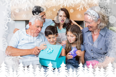 Composite image of extended family sitting on sofa with gift box