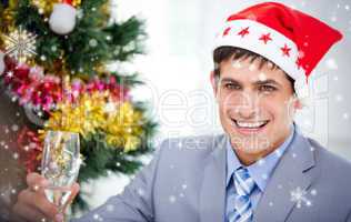 Composite image of businessman celebrating christmas