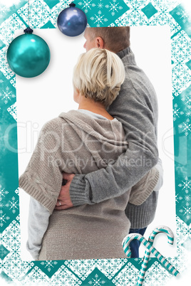 Composite image of happy mature couple in winter clothes