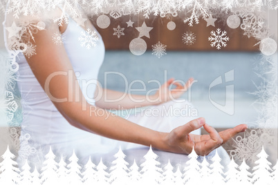 Peaceful woman in white sitting in lotus pose