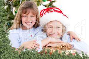 Composite image of adorable childrens celebrating christmas