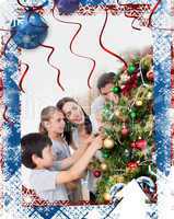 Composite image of happy family decorating a christmas tree with