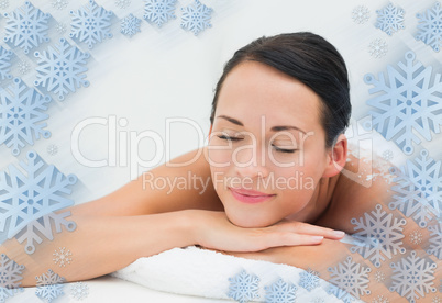 Peaceful brunette lying with salt scrub on back