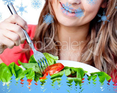 Composite image of close up of a delighted woman is eating a sal
