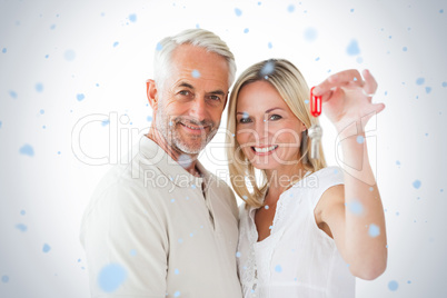 Happy couple showing their new house key