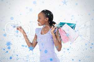 Woman with her shopping and credit card on white background