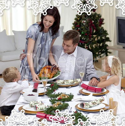 Parents and children in christmas dinner with turkey