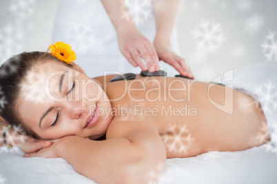 Close up of a woman enjoying a hot stone massage