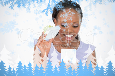 Close up of woman being happy about what is in her present against a white backgr