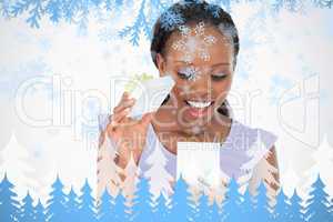 Close up of woman being happy about what is in her present against a white backgr
