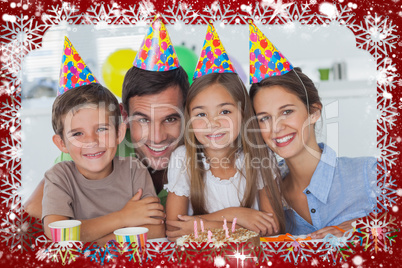 Composite image of beautiful family celebrating a party