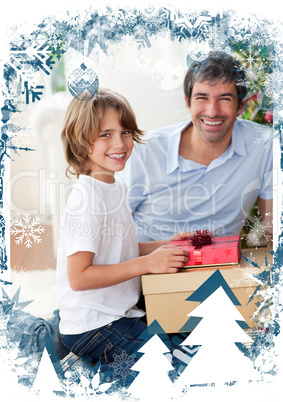 Smiling father and his son opening christmas presents