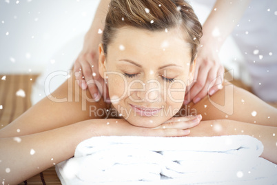 Relaxed woman enjoying a back massage