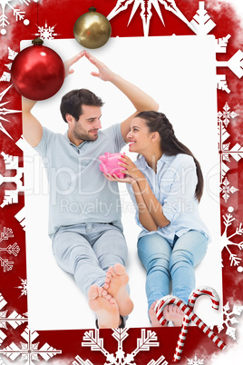 Composite image of cute couple considering a mortgage