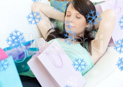 Tired young woman relaxing after shopping