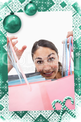 Composite image of portrait of a cheerful woman showing shopping