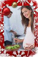 Pregnant woman preparing a salad in the kitchen