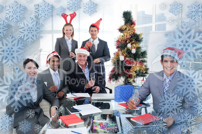 Composite image of portrait of a happy business team toasting wi