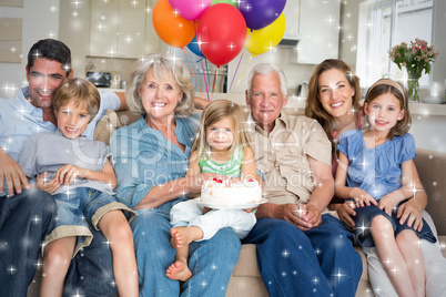 Composite image of multigeneration family celebrating girls birt
