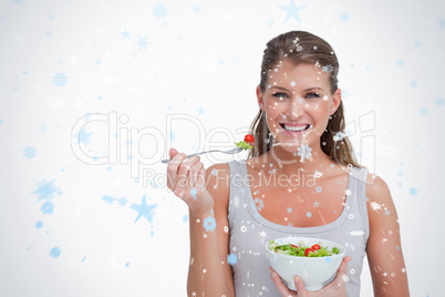 Composite image of woman eating a salad