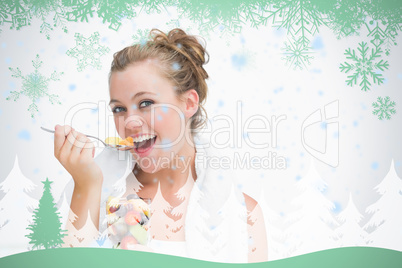 Woman eating fruit and smiling