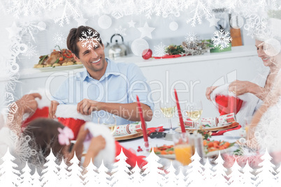 Composite image of cheerful family dining together