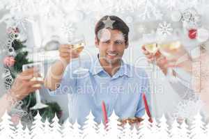 Composite image of family toasting at christmas dinner