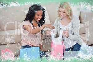 Two women look through shopping bags