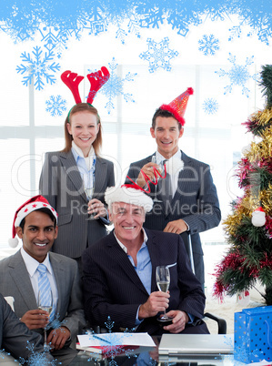 Smiling business people wearing novelty christmas hat