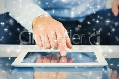 Close up of finger from man touching tablet