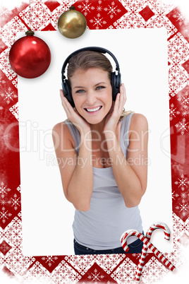 Composite image of portrait of a smiling woman listening to musi