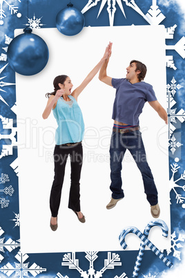 Composite image of portrait of a couple jumping together
