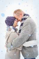 Composite image of happy mature couple in winter clothes hugging