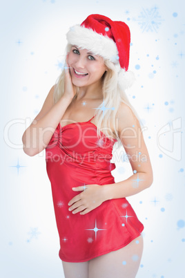 Excited woman wearing santa hat