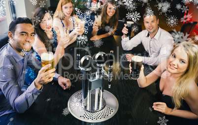 Composite image of attractive friends raising glasses up smiling