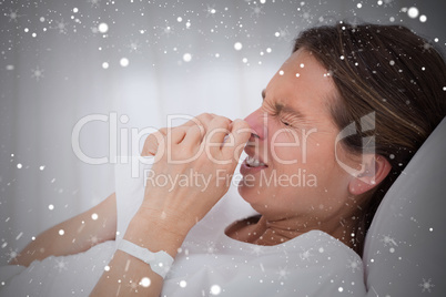 Composite image of side view of sneezing woman