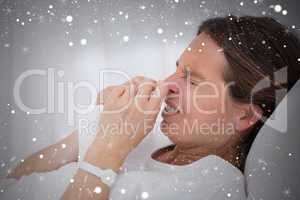 Composite image of side view of sneezing woman