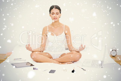 Natural young brown haired model in white pajamas practicing yog
