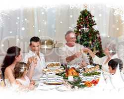 Grandparents and parents toasting in a christmas dinner