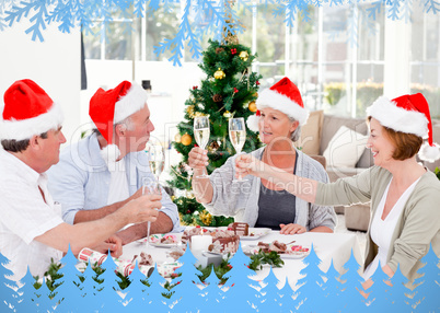 Family toasting a nice meal with frost and fir trees in blue