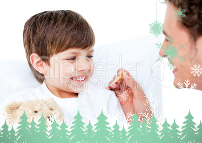 Handsome doctor taking little boys temperature