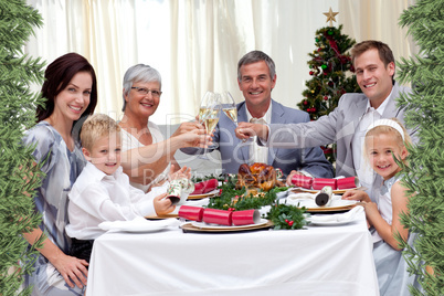 Family tusting in a christmas dinner