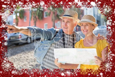 Happy tourist couple using map in the city