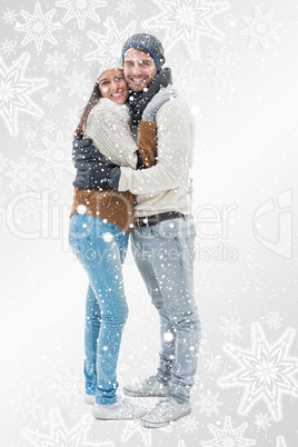 Attractive young couple in warm clothes hugging