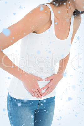 Closeup mid section of a casual woman with stomach pain