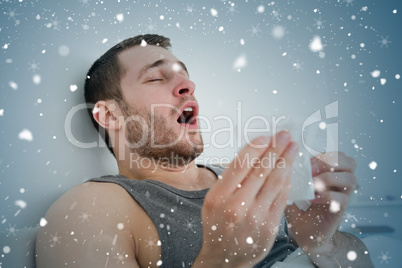 Composite image of sick man sneezing