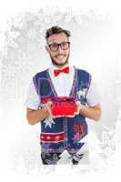 Composite image of geeky hipster offering christmas gift