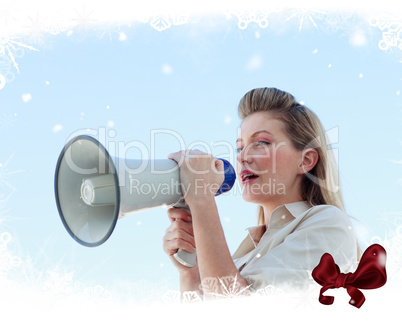 Blonde businesswoman shouting through megaphone