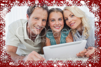 Composite image of portrait of a girl and her parents using a ta