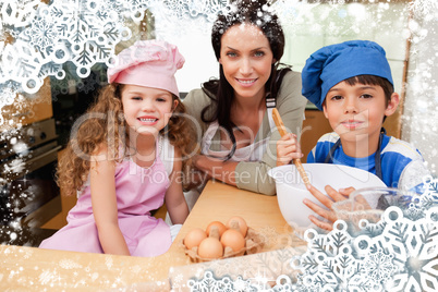 Composite image of mother and her children preparing cookies